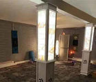 Interior room with an illuminated salt-clad column