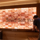 Installing Backlit Himalayan Pink Salt Bricks with Adhesive in Sauna Feature Wall