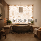 Luxury Spa Bathroom Featuring Stone Soaking Tub and Backlit Himalayan Salt Brick Wall